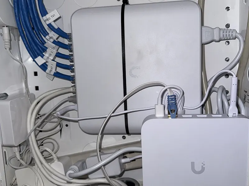 UniFi gear inside an apartment media panel in Dumbo