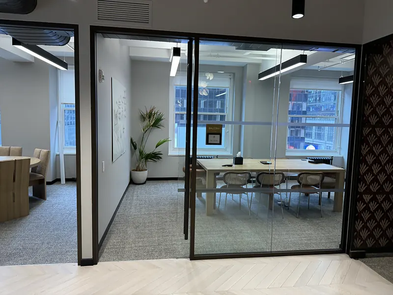 Glass-walled conference room in a Midtown office