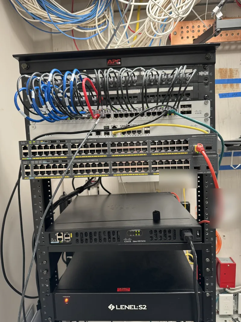 Office network rack with patch panels, switches and patch cables