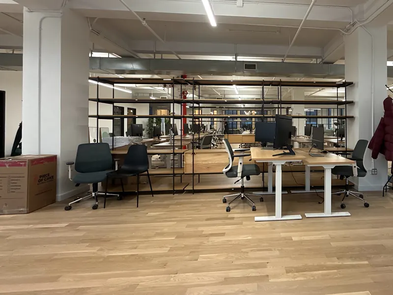 Open office floor with desks and chairs during move-in week