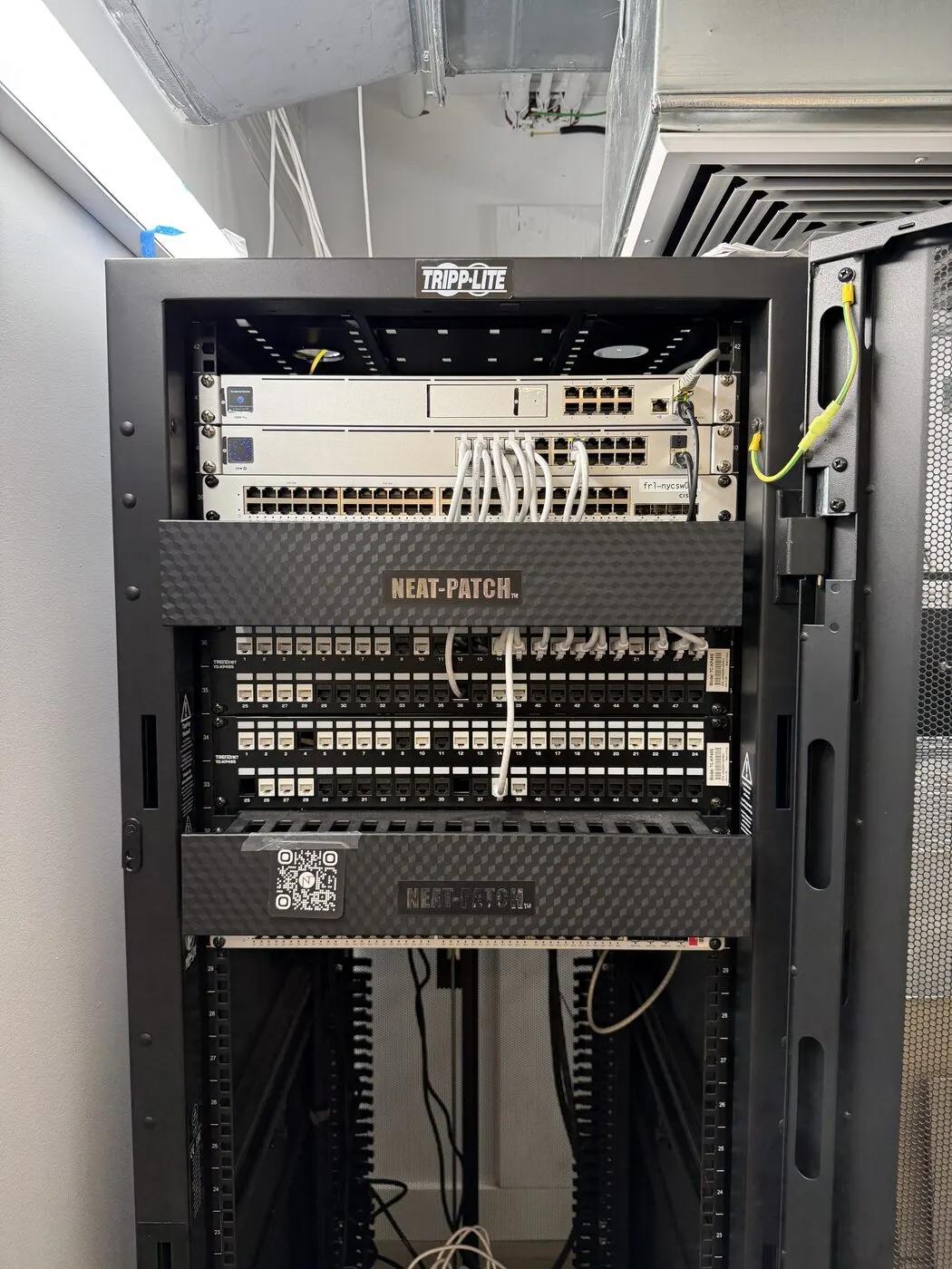 Neat-patched UniFi rack after office Wi-Fi bring-up near Union Square